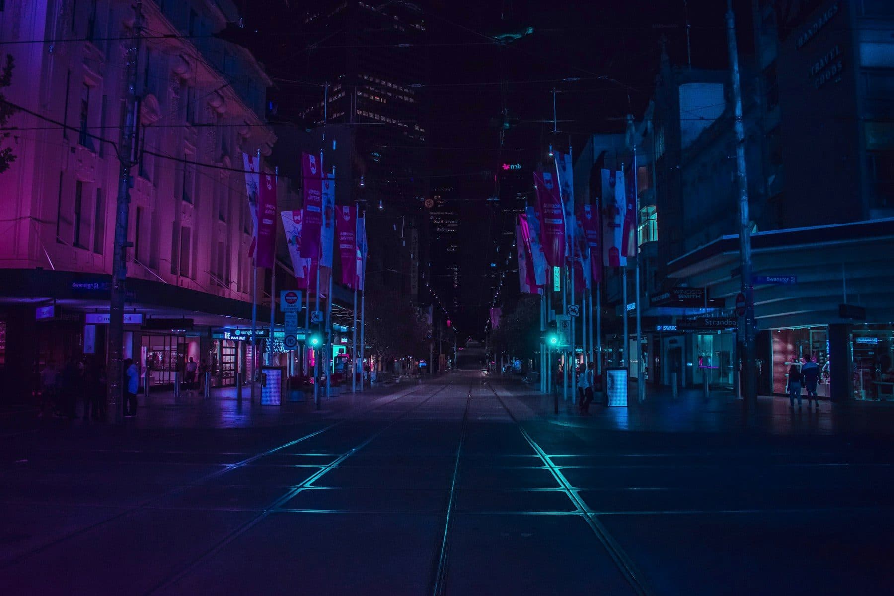 Still from Nocturne: night street in magenta and cyan.